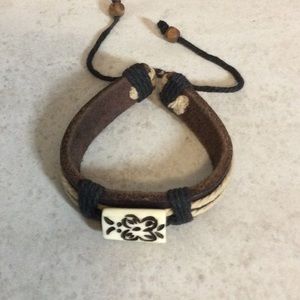 Leather boho bracelet with ivory bead etched flower